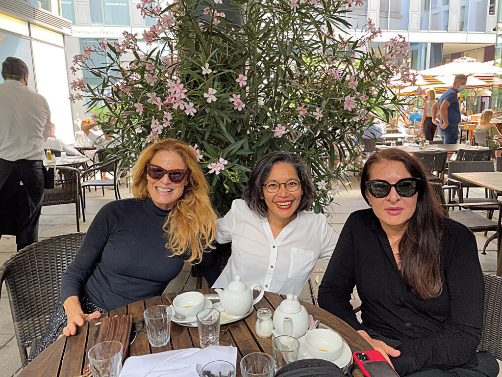 From left to right Independent curator Petra Giloy Hirtz, Carina Evangelista, and Marina Abramović in Munich photo credit Todd Eckert