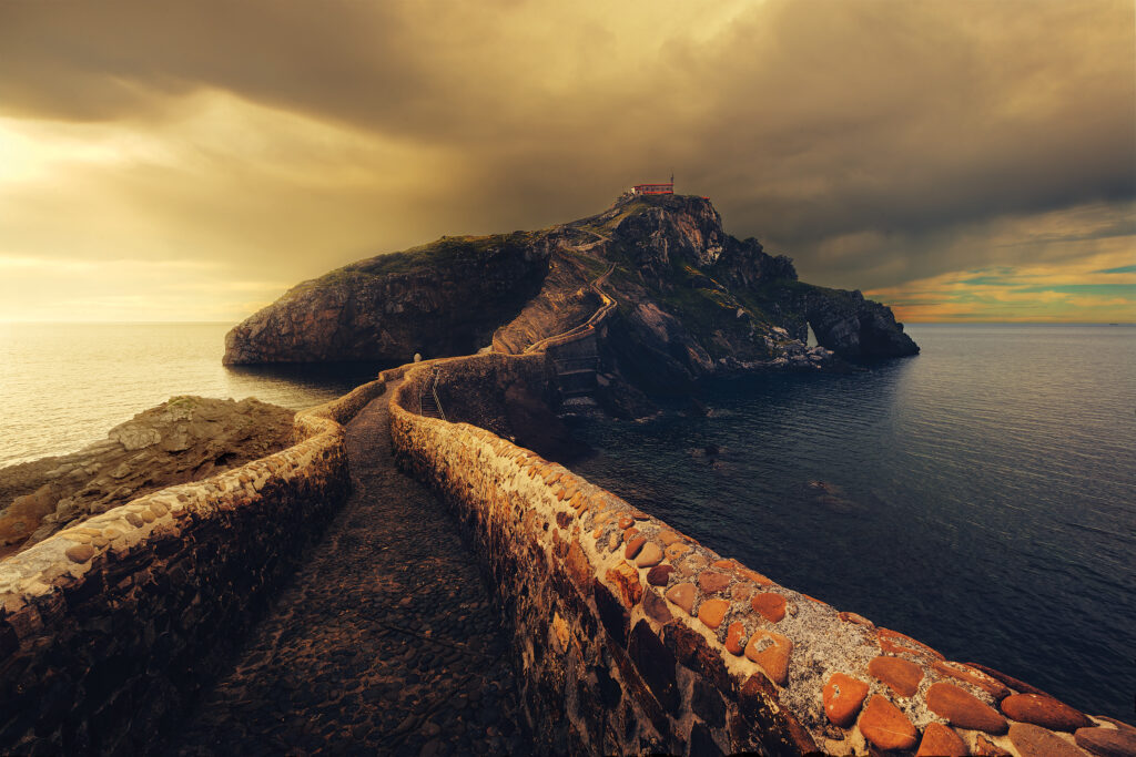 Europe: The islet of Gaztelugatxe is located in the Biscay province of northern Spain. Atop the island is a hermitage that dates from the tenth century.