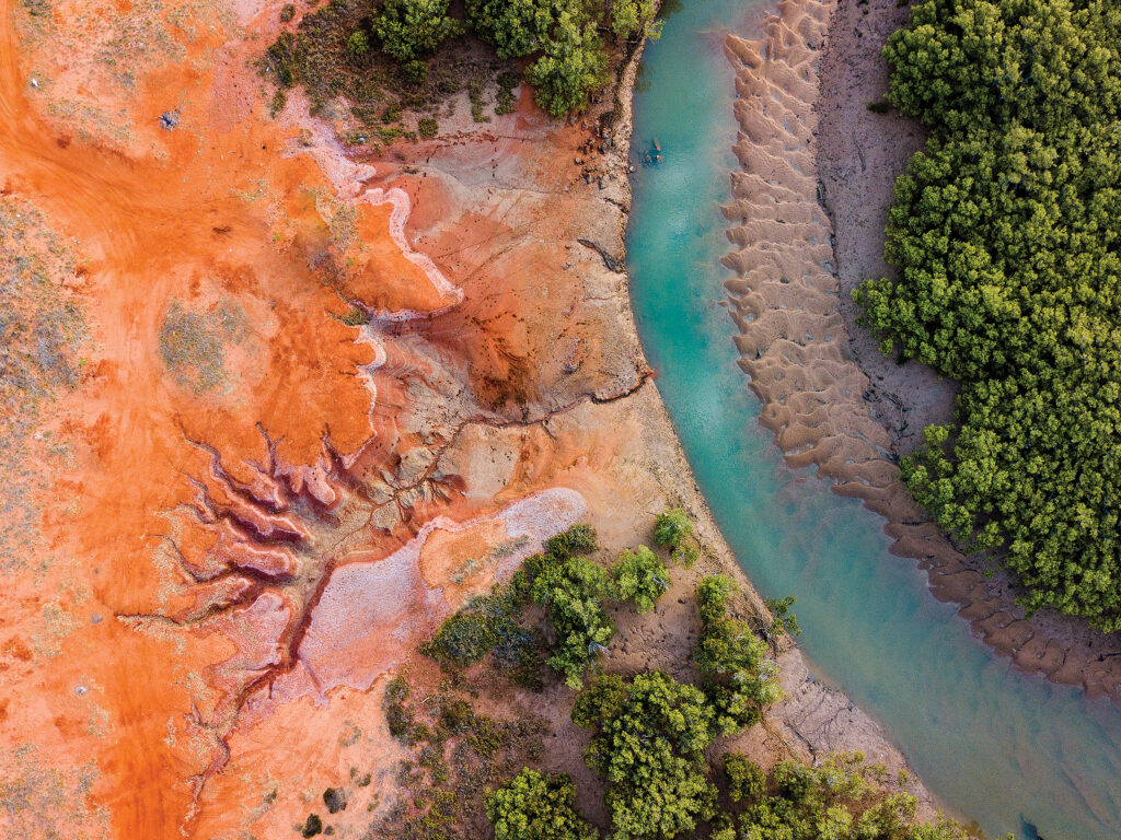 Aerial View Of River By Dramatic Landscape