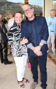 two people pose together for a photo