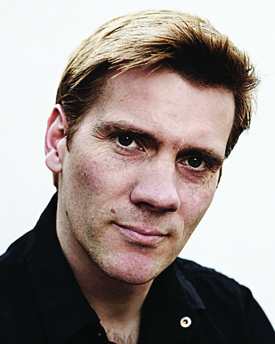 A direct photo portrait of a man, an English dancer, choreographer, actor, and director Adam Cooper