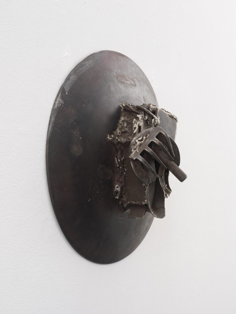 detail of a metal sculpture made from welded mechanical parts