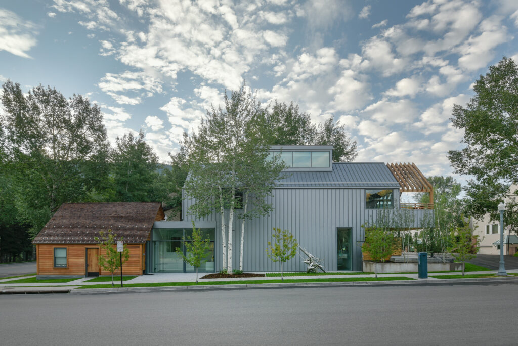 a small wooden cabin-like building a larger metal barn-like building make up the Marianne Boesky Gallery