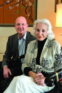 A woman and her adult grandson sit down to discuss philanthropy