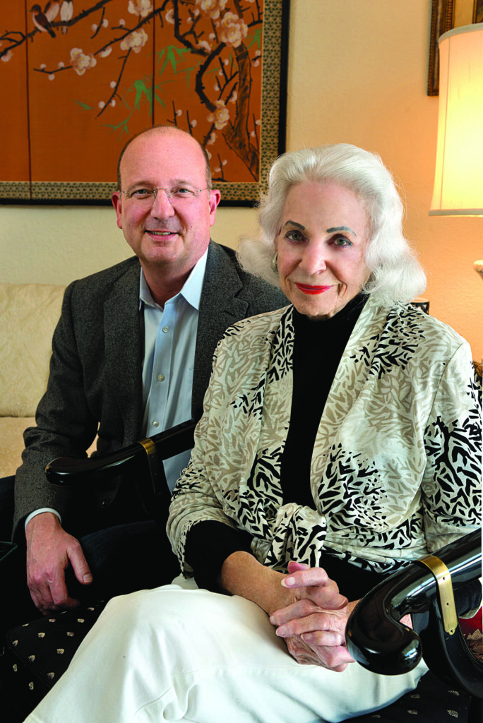 A woman and her adult grandson sit down to discuss philanthropy