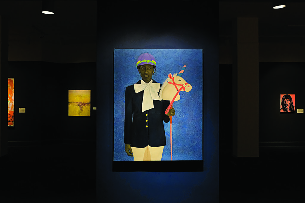 A dimly lit gallery displaying vivid paintings, including a central portrait of a figure holding a toy horse