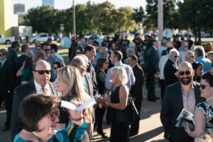 Groundbreaking crowd gathers in an outside space