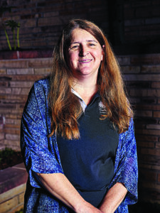 a woman poses for a picture
