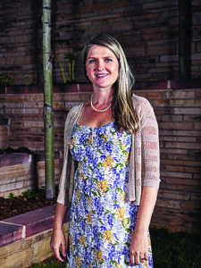 a woman poses for a picture