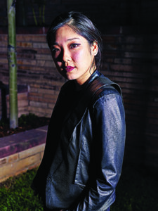 a woman poses for a picture
