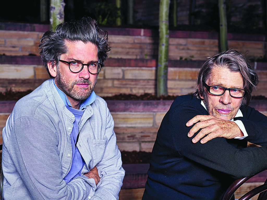 two men pose for a picture