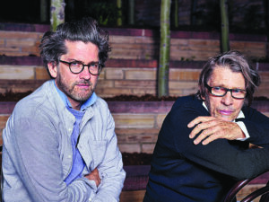 two men pose for a picture
