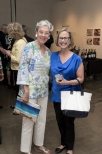 two women pose for a photo